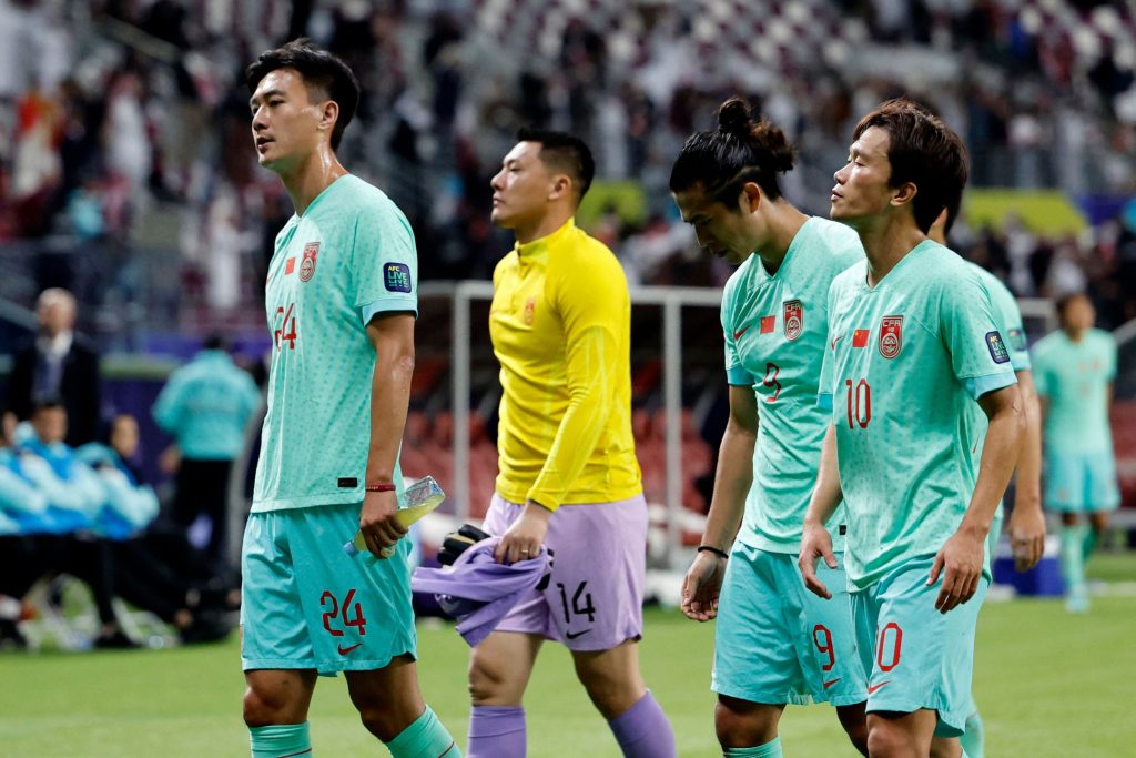 丢失直接晋级机会，中国队球员难掩失望心情。——照片：路透社